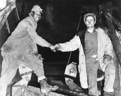 The Alaska Highway handshake, Beaver Creek, Yukon